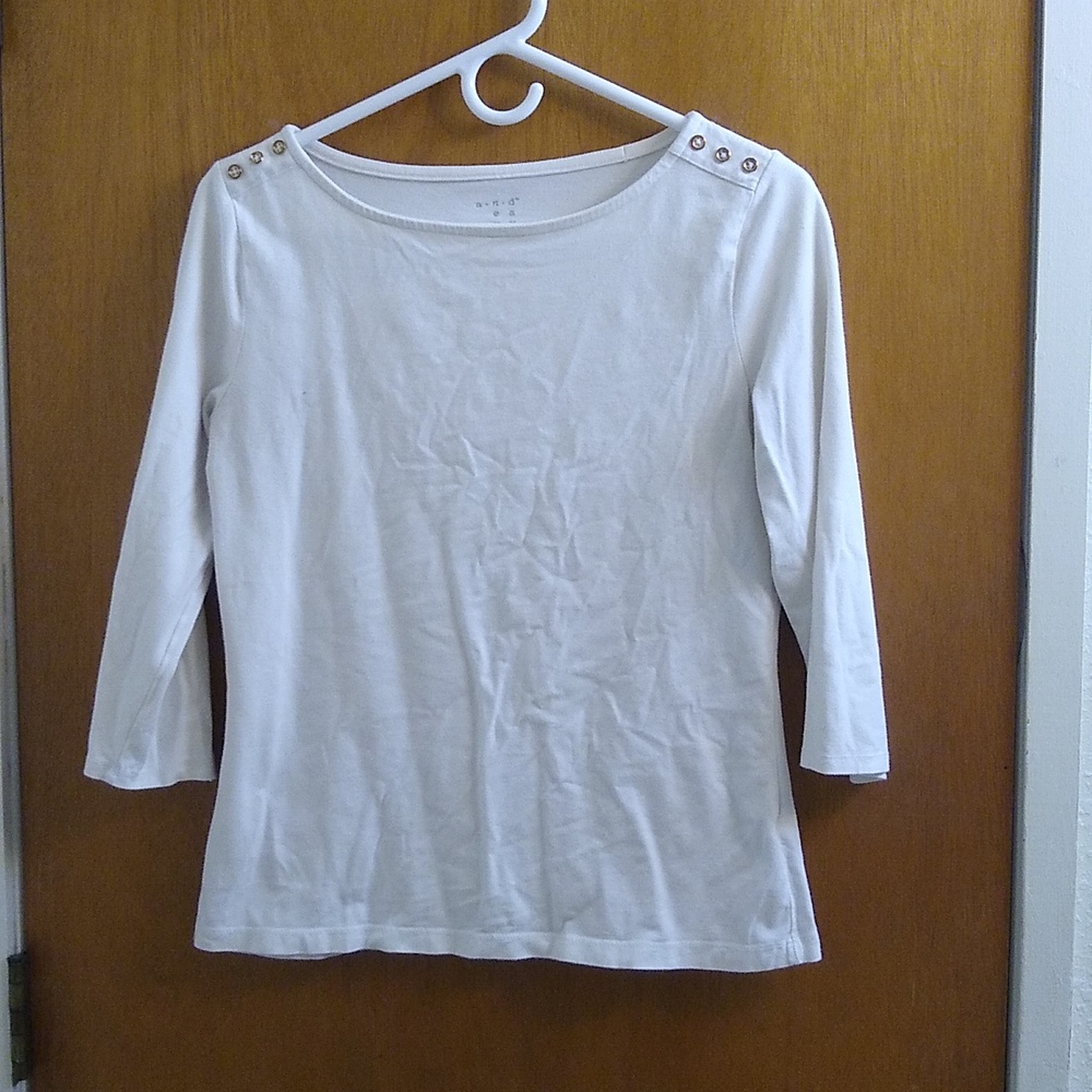 White shirt with gold buttons